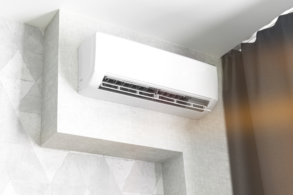 An indoor mini split unit installed on a white wall.